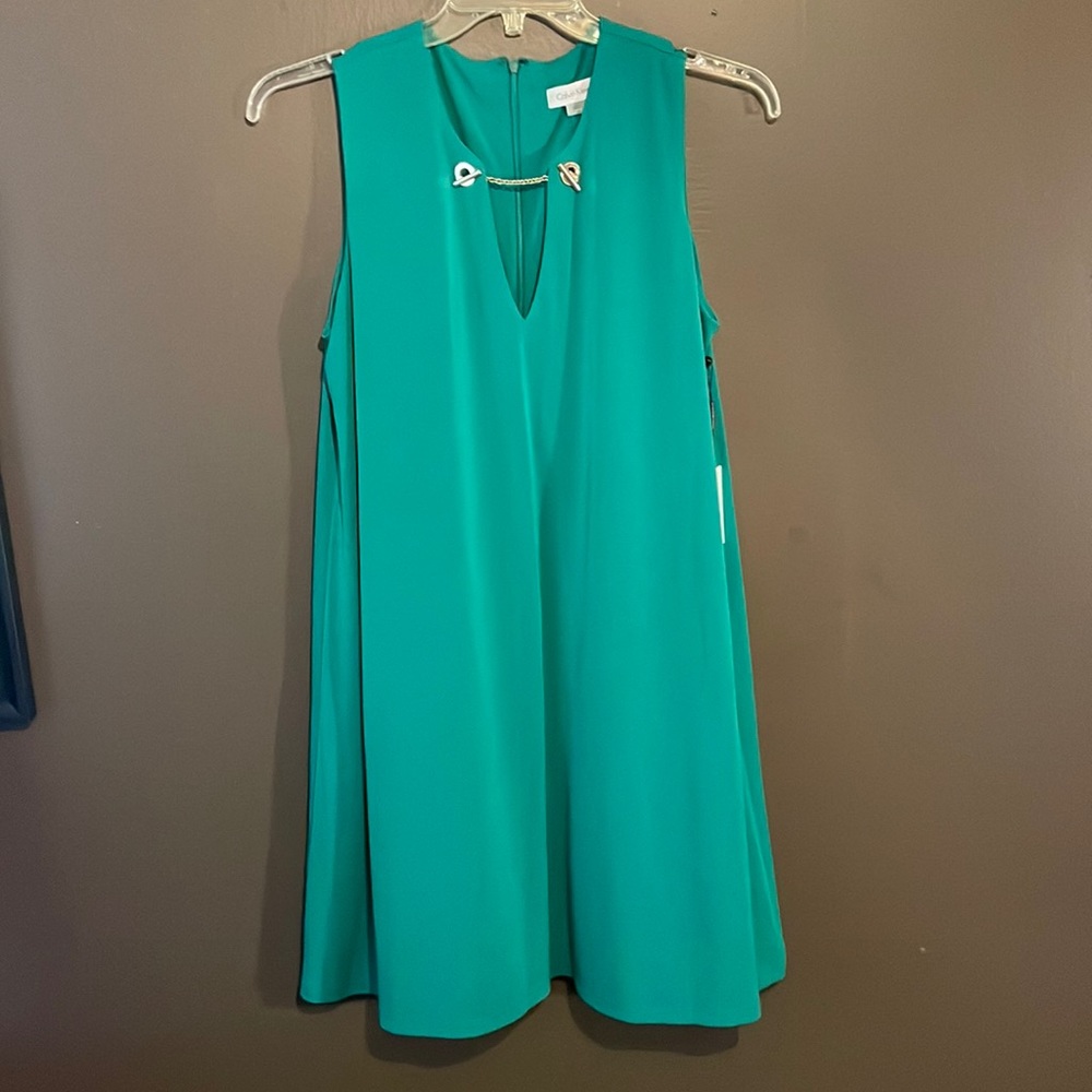Lightweight, sleeveless Green Calvin Klein dress. Never worn, with tags.